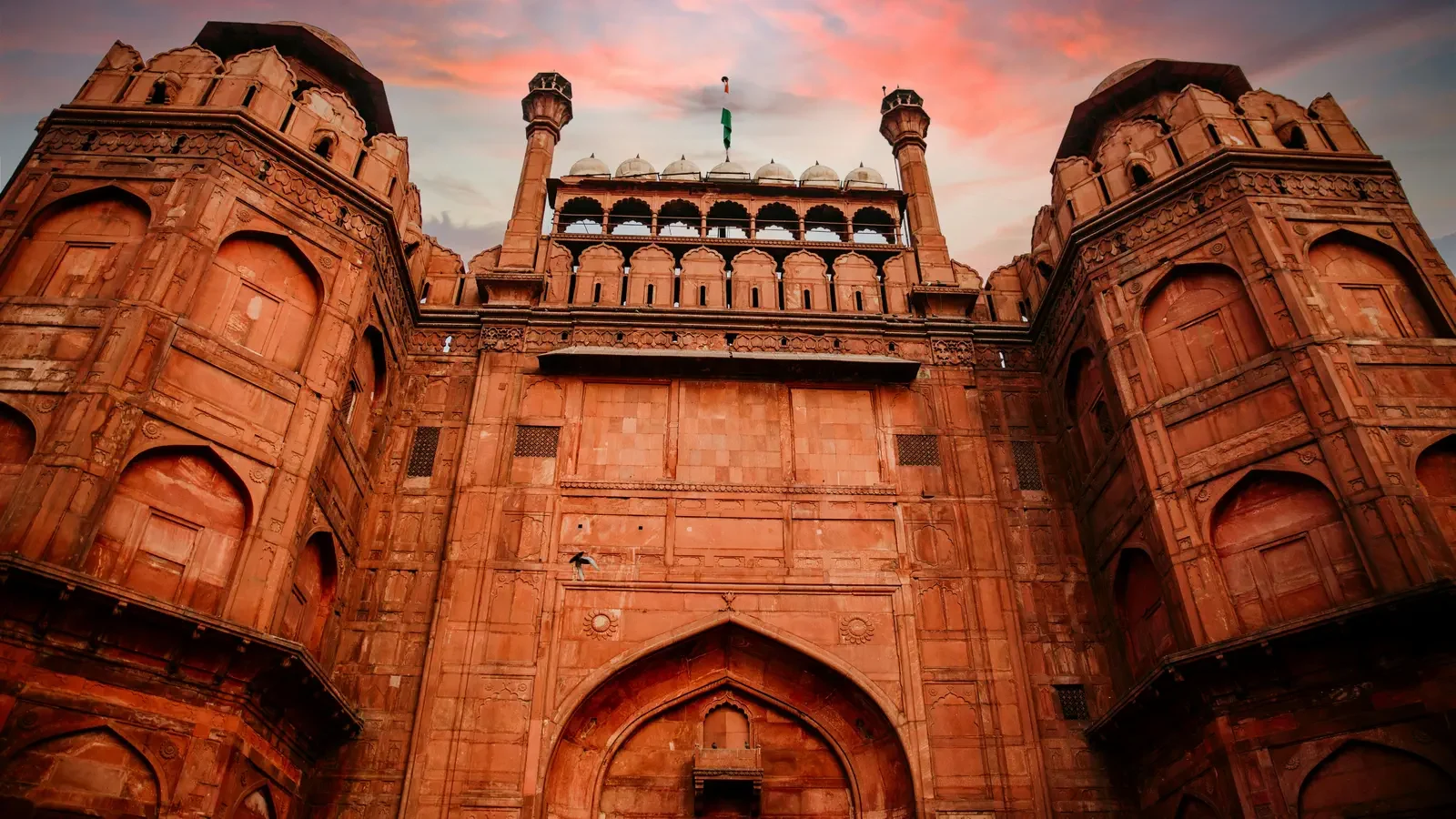 Red Fort in Delhi at sunset under a striking sky