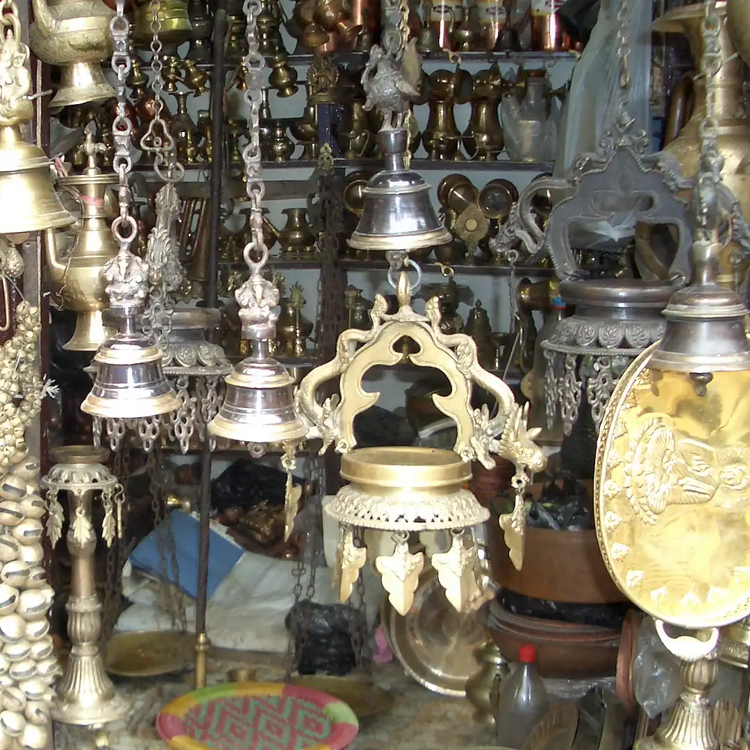 India and Nepal with AlanSpeak Travel. Shop selling metal crafts.